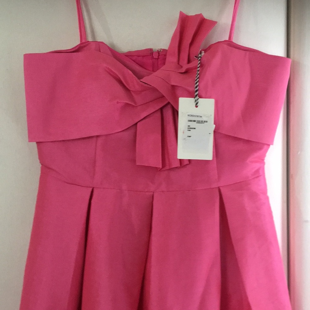 Barbie pink dress with tags on.
